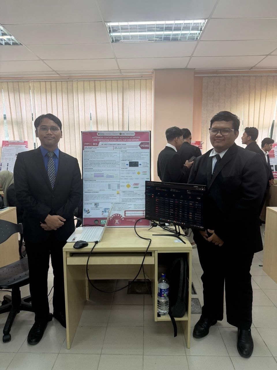 At the FYP poster and demo setup