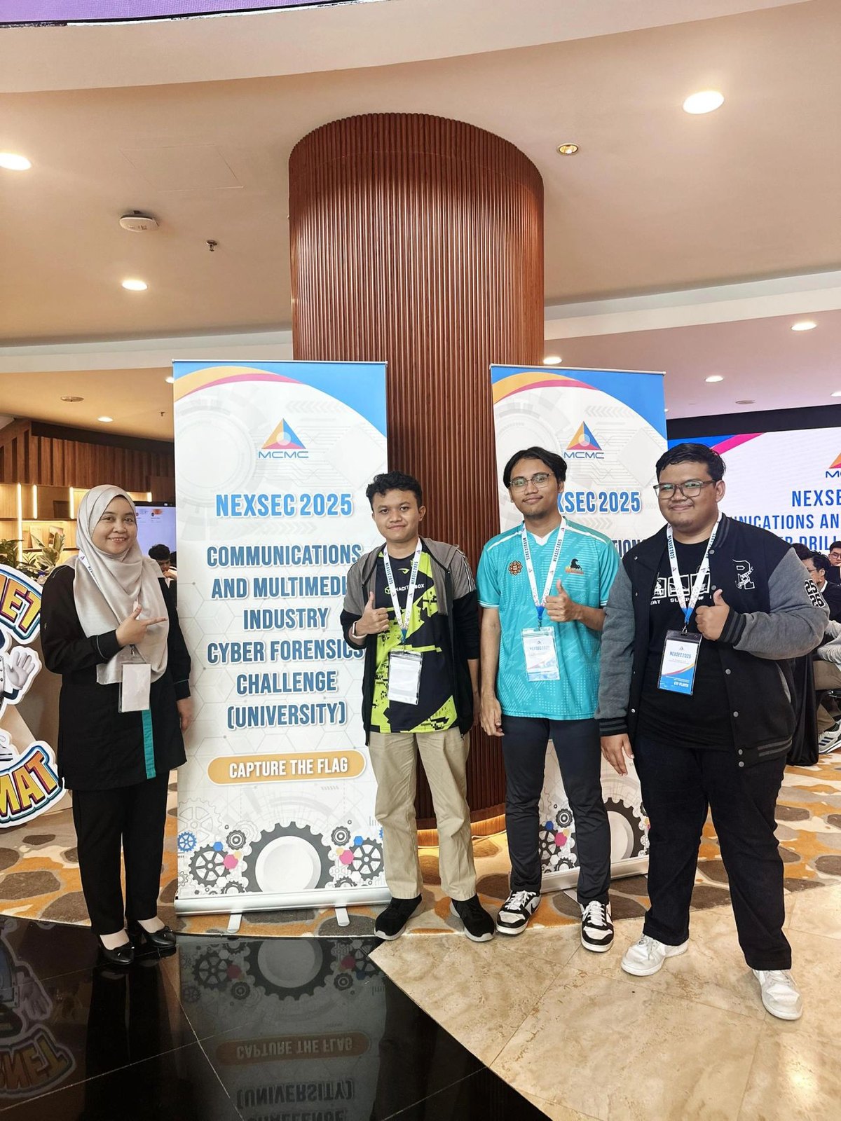 Team at the NEXSEC backdrop